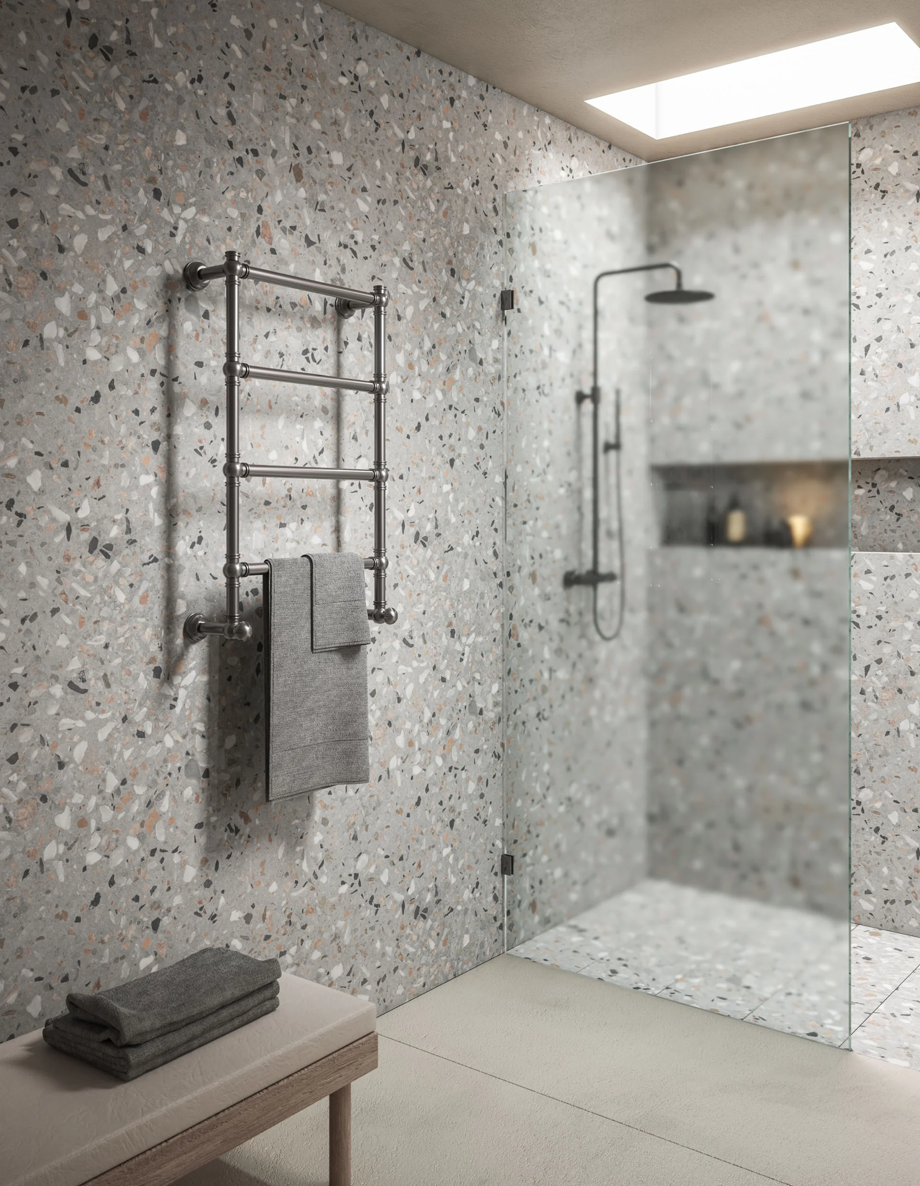 Margaroli towel warmer against a terrazzo shower wall